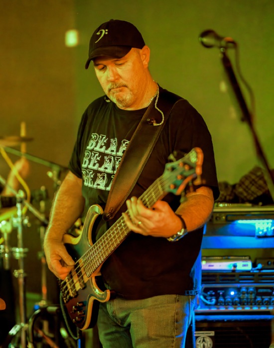 Mike Bright playing bass on stage